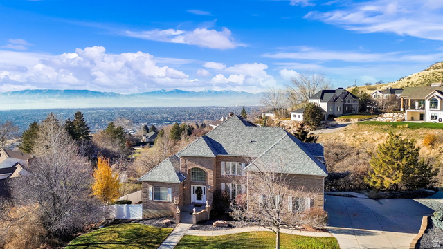 1085 Windsor Drive Provo, UT 84604 - Photo 5 of 83 French provincial home featuring a valley view, brick siding, a residential view, and a front lawn