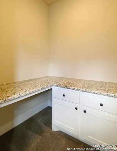 a view of an empty room with a stove