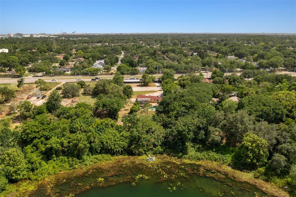 7775 Conroy Windermere Road Orlando, FL 32835 - Photo 3 of 3 an aerial view of residential houses with outdoor space and trees