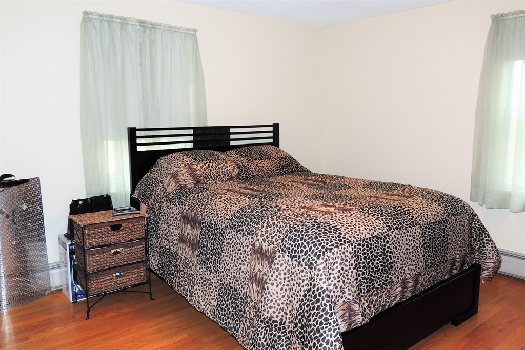52 Carnavon Circle Springfield, MA 01109 - Photo 11 of 16 a bed sitting in a room next to a window