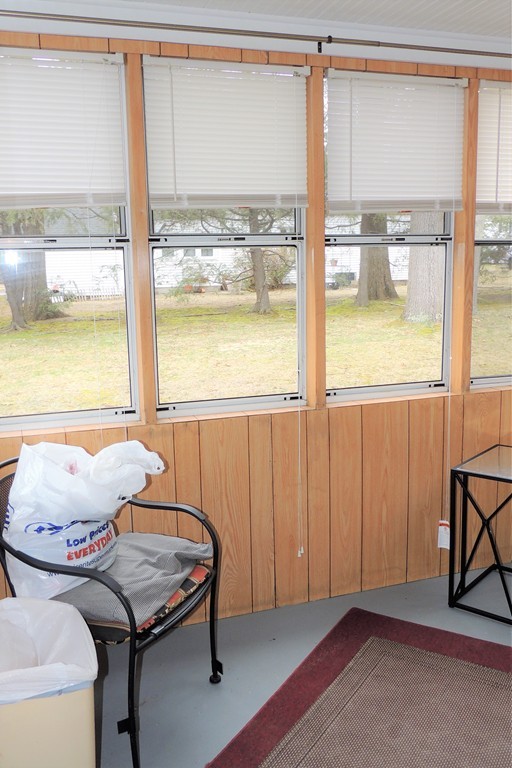 52 Carnavon Circle Springfield, MA 01109 - Photo 13 of 16 a living room with furniture and floor to ceiling windows