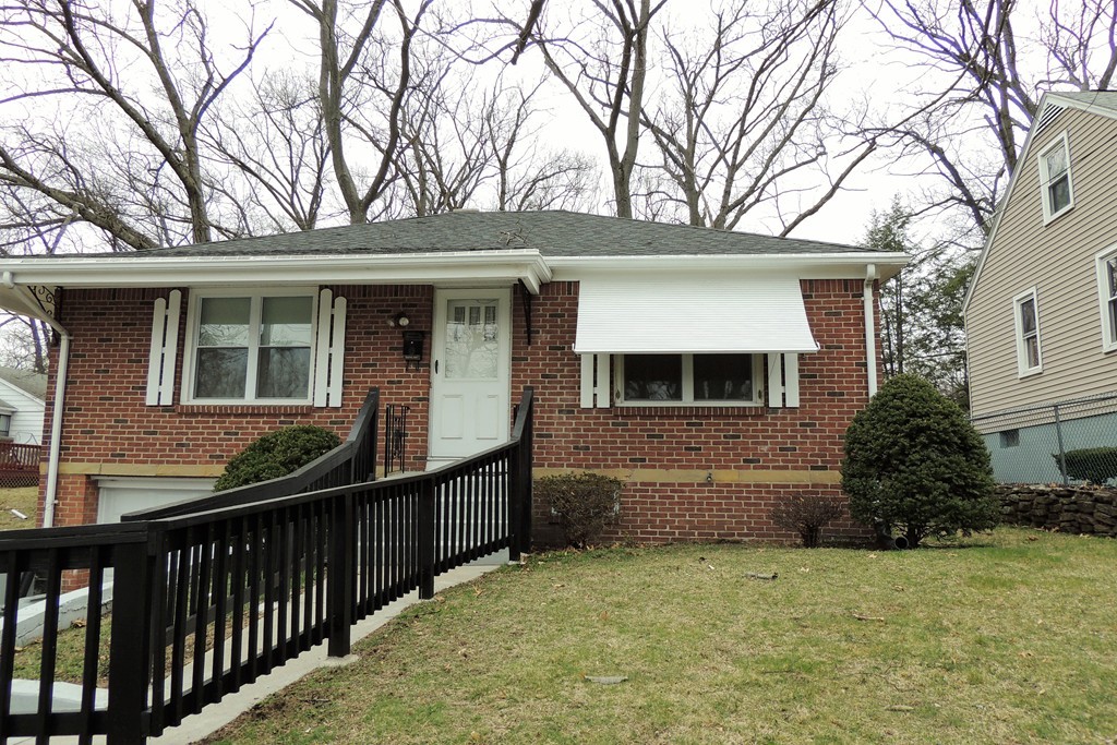 52 Carnavon Circle Springfield, MA 01109 - Photo 15 of 16 a front view of a house with yard