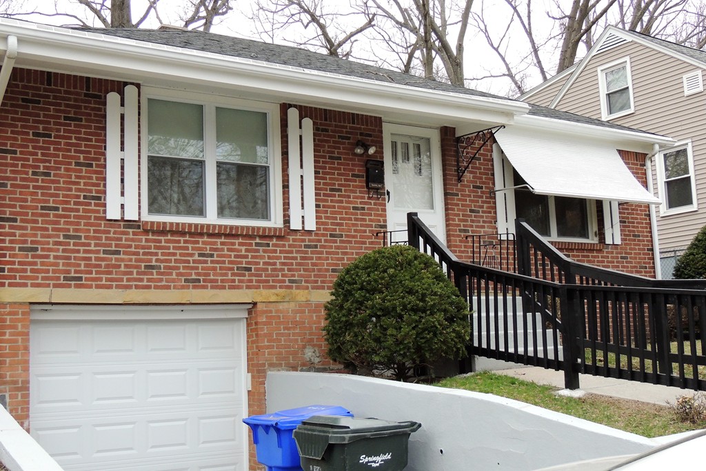 52 Carnavon Circle Springfield, MA 01109 - Photo 16 of 16 a front view of a house with a yard
