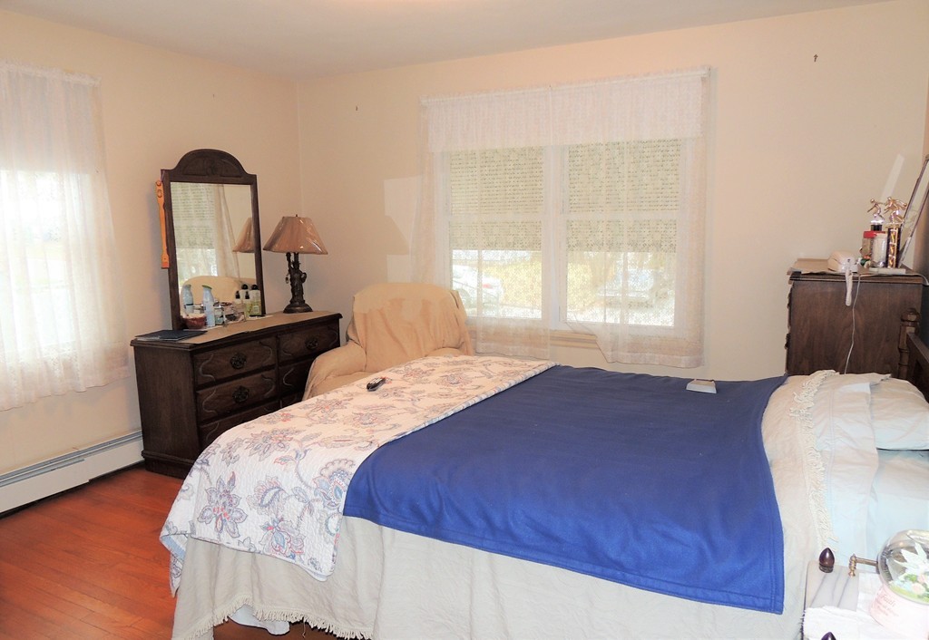52 Carnavon Circle Springfield, MA 01109 - Photo 9 of 16 a bedroom with a bed and a window