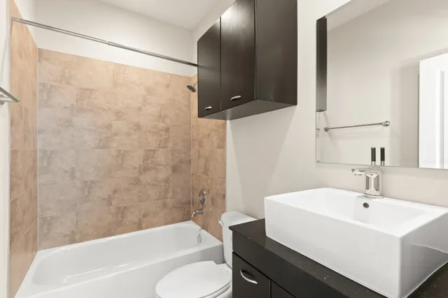 a bathroom with a double vanity sink and mirror