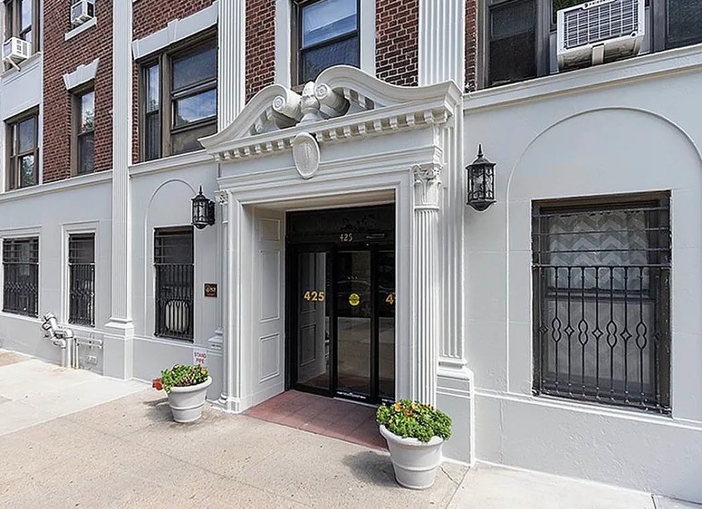 425 Riverside Drive, Unit 7I Manhattan, NY 10025 - Photo 12 of 14 a front view of a house with outdoor seating