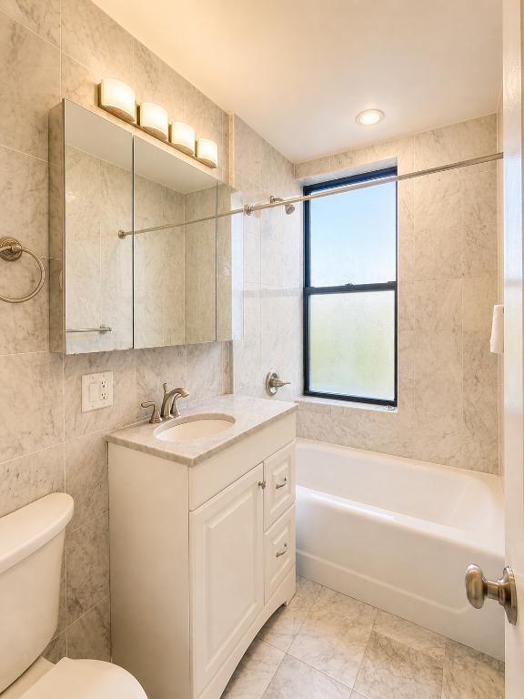 425 Riverside Drive, Unit 7I Manhattan, NY 10025 - Photo 4 of 14 a bathroom with a toilet sink and bathtub