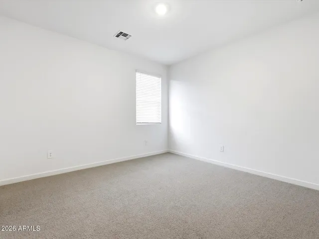 a bathroom with a granite countertop sink toilet a mirror and shower