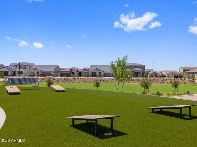 a view of a golf course with chairs