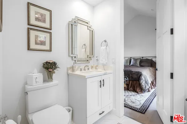 a bathroom with a sink toilet and vanity