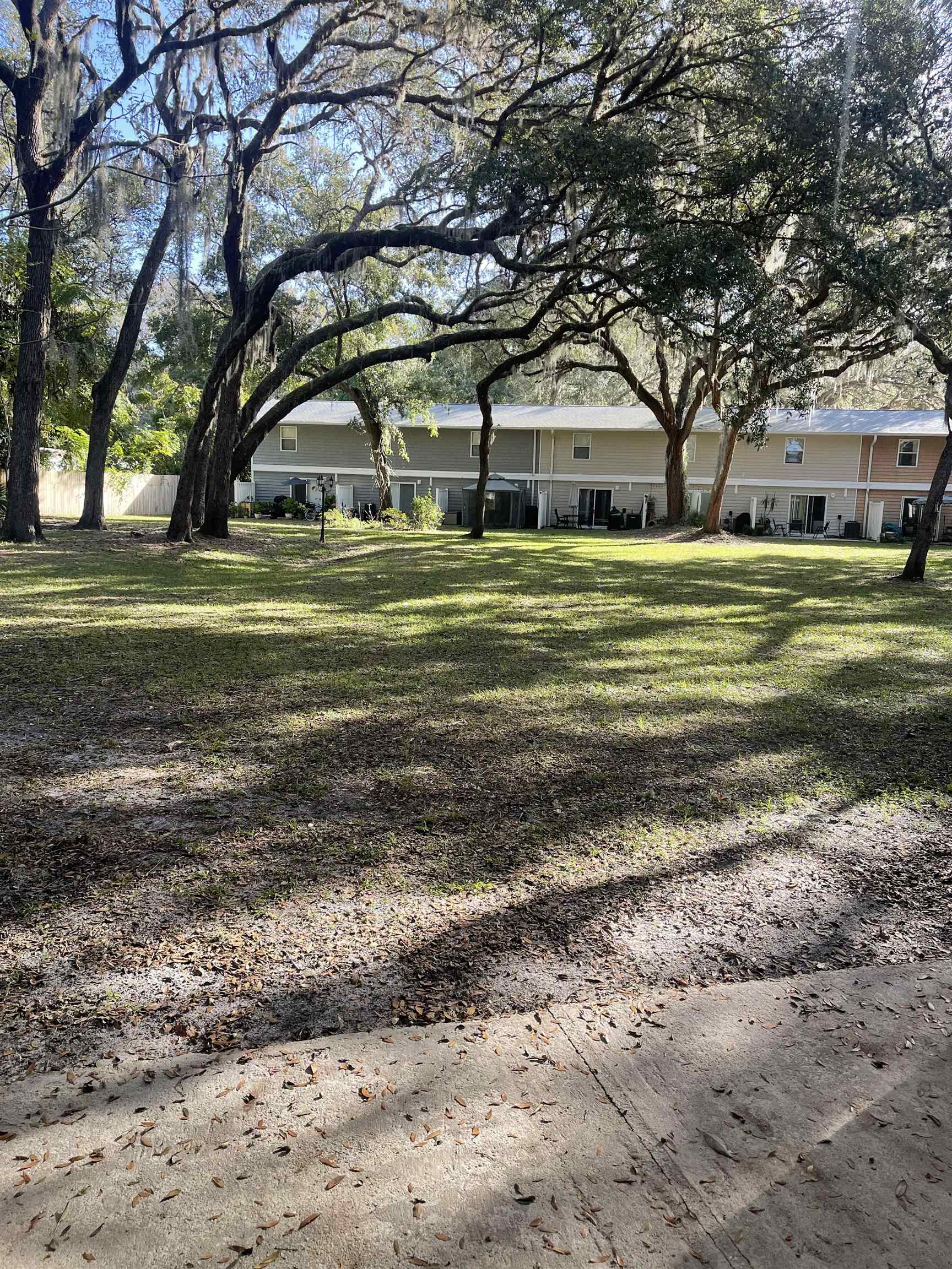 4420 Carter Road, Unit 44 St. Augustine, FL 32086 - Photo 11 of 11 a big yard with large trees