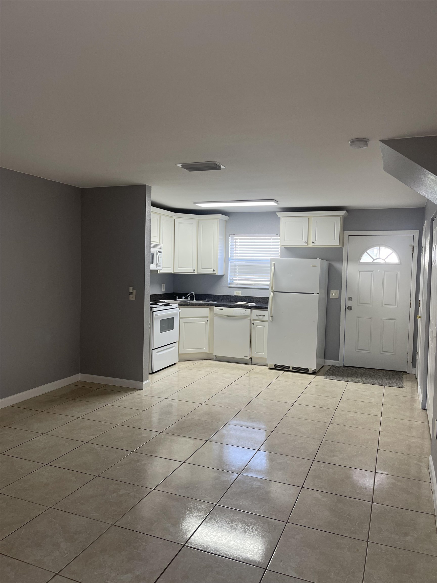 4420 Carter Road, Unit 44 St. Augustine, FL 32086 - Photo 2 of 11 a large kitchen with cabinets and a stove top oven