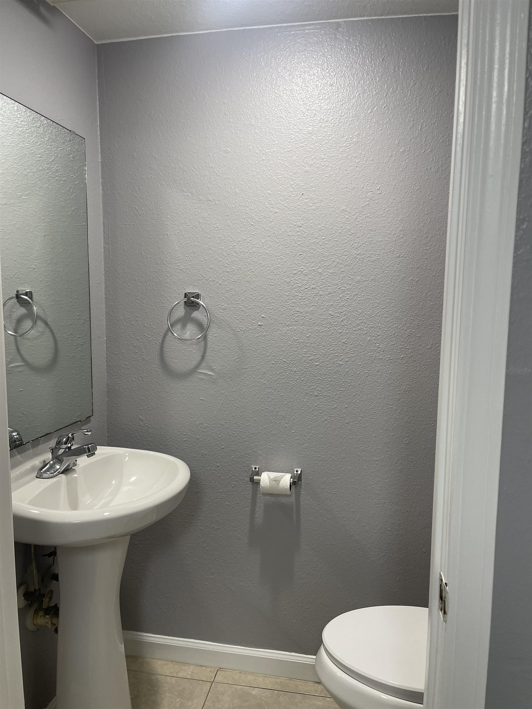4420 Carter Road, Unit 44 St. Augustine, FL 32086 - Photo 3 of 11 a bathroom with a sink a mirror and a toilet