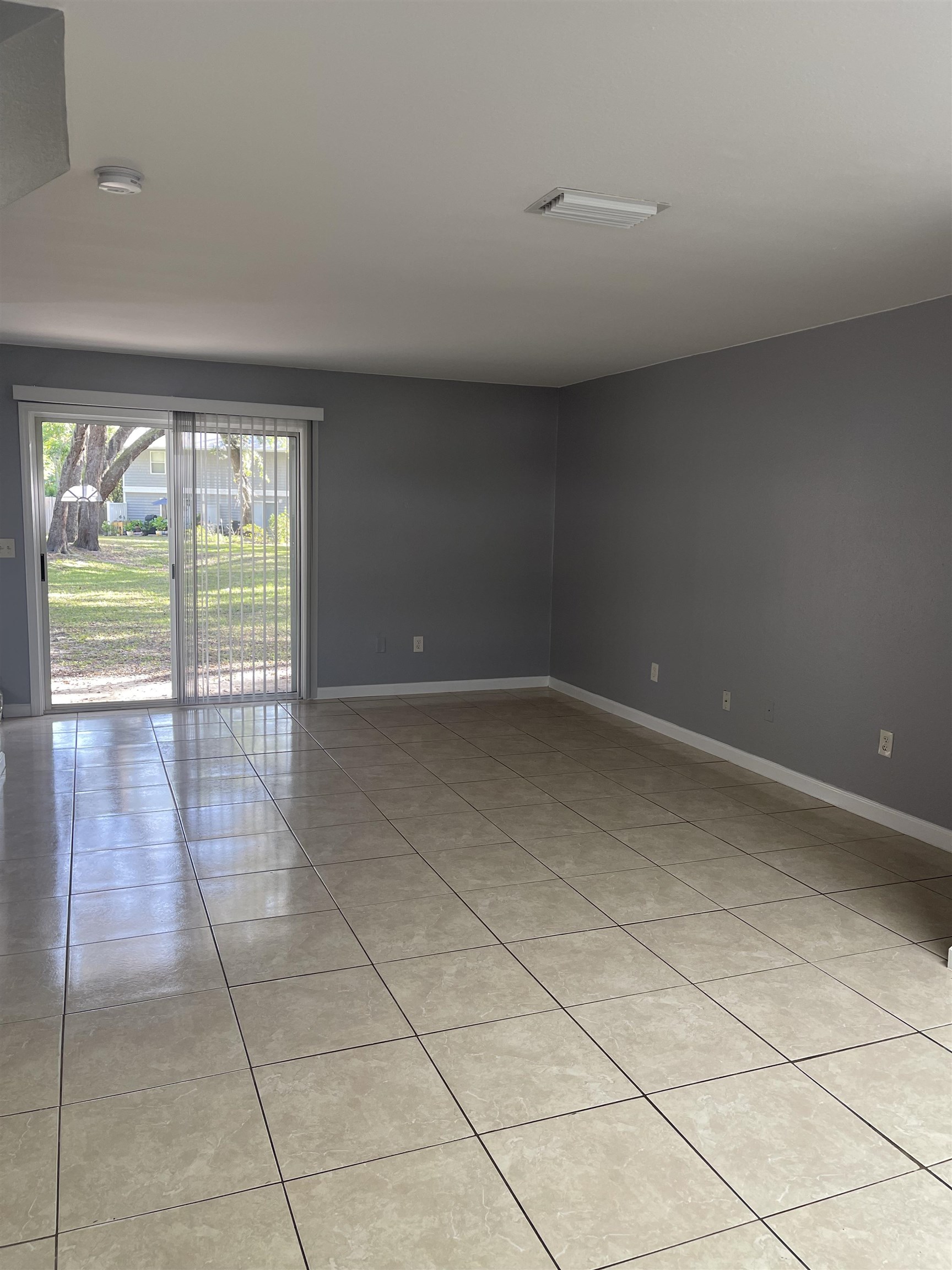 4420 Carter Road, Unit 44 St. Augustine, FL 32086 - Photo 4 of 11 a view of empty room with wooden floor and fan