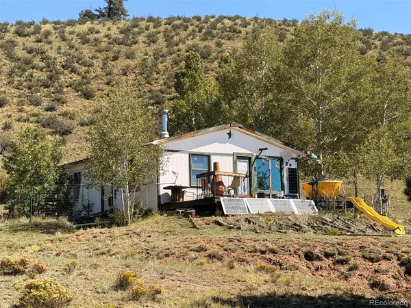 a backyard of a house with barbeque oven