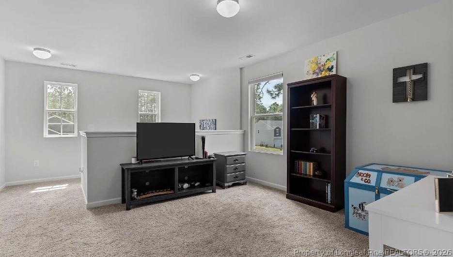 172 Mildred Way Road Aberdeen, NC 28315 - Photo 4 of 7 a living room with furniture and a flat screen tv