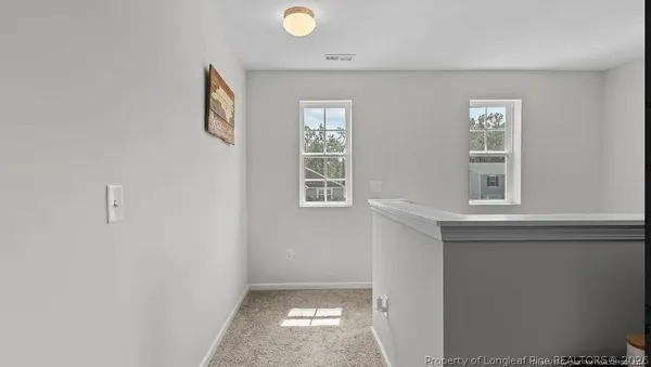 a view of livingroom with furniture and window