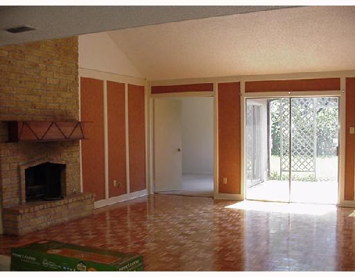 4121 Boros Drive Corpus Christi, TX 78413 - Photo 2 of 3 a view of an empty room with wooden floor and a fireplace
