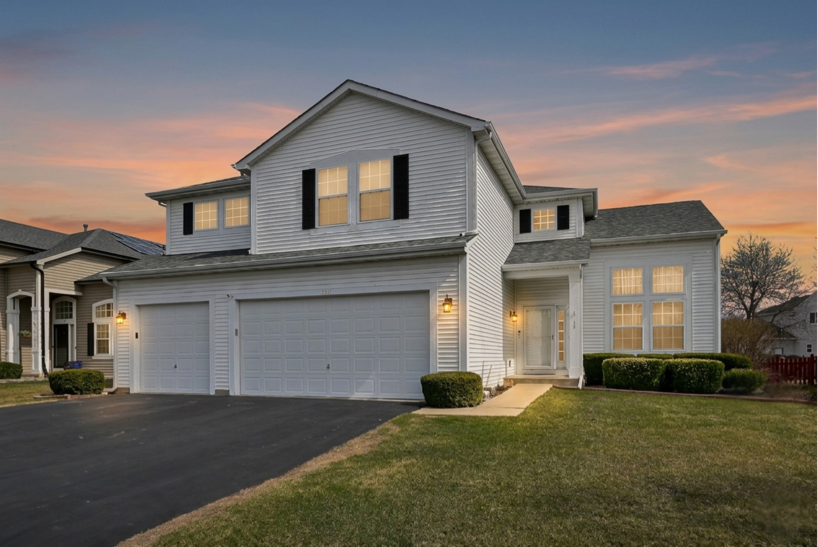 230 Stickley Lane Lake In The Hills, IL 60156 - Photo 1 of 52 a front view of a house with a yard and garage