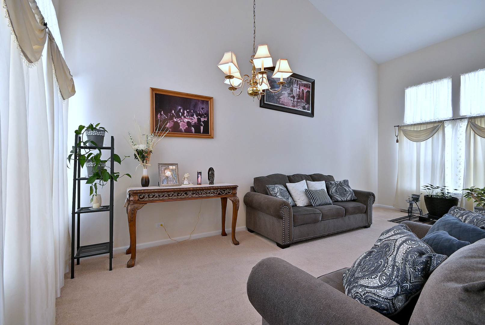 230 Stickley Lane Lake In The Hills, IL 60156 - Photo 14 of 52 a living room with furniture a chandelier and a window