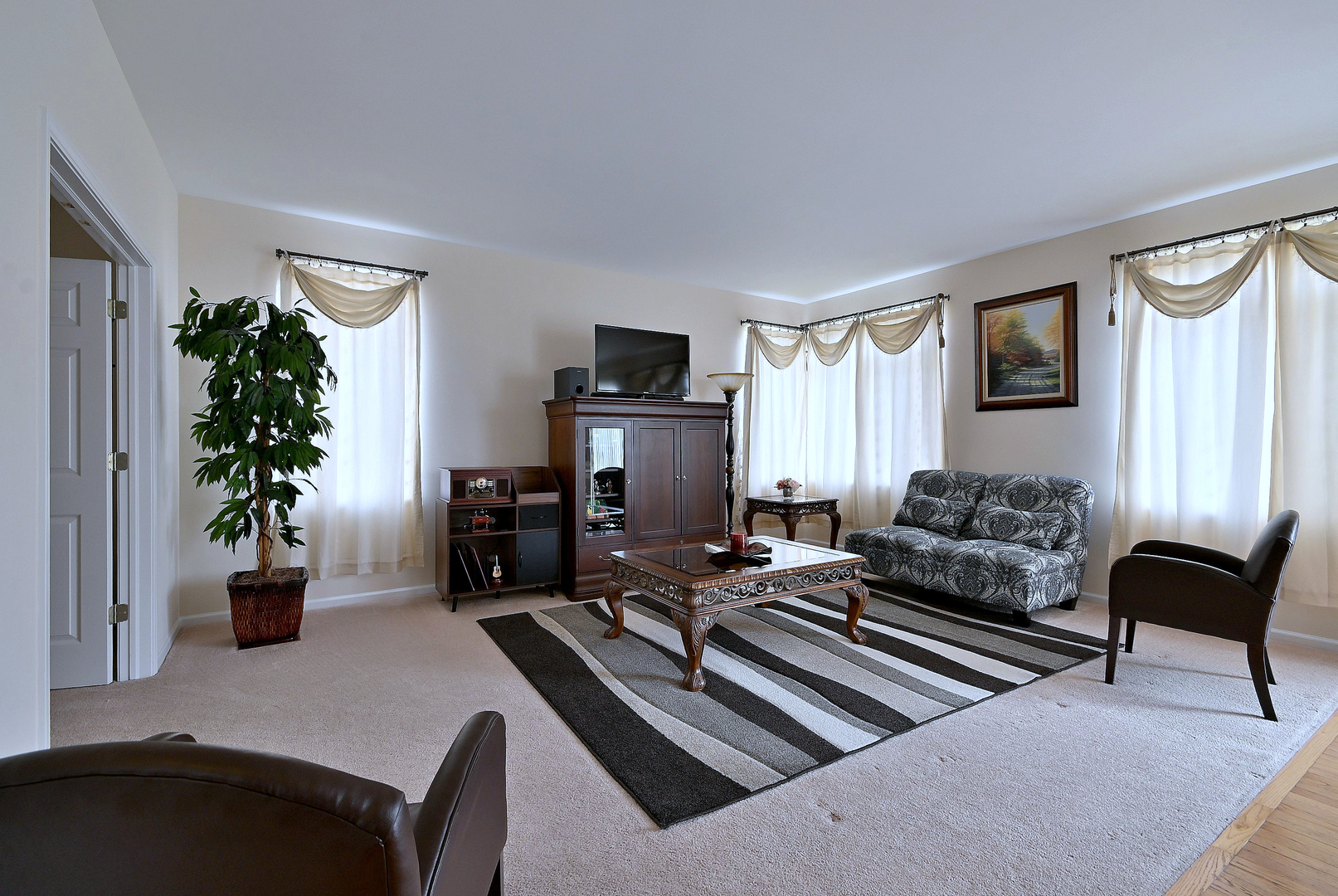 230 Stickley Lane Lake In The Hills, IL 60156 - Photo 21 of 52 a living room with furniture and a potted plant