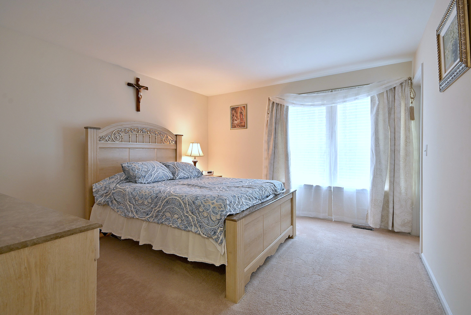 230 Stickley Lane Lake In The Hills, IL 60156 - Photo 32 of 52 a bedroom with a bed and a chandelier