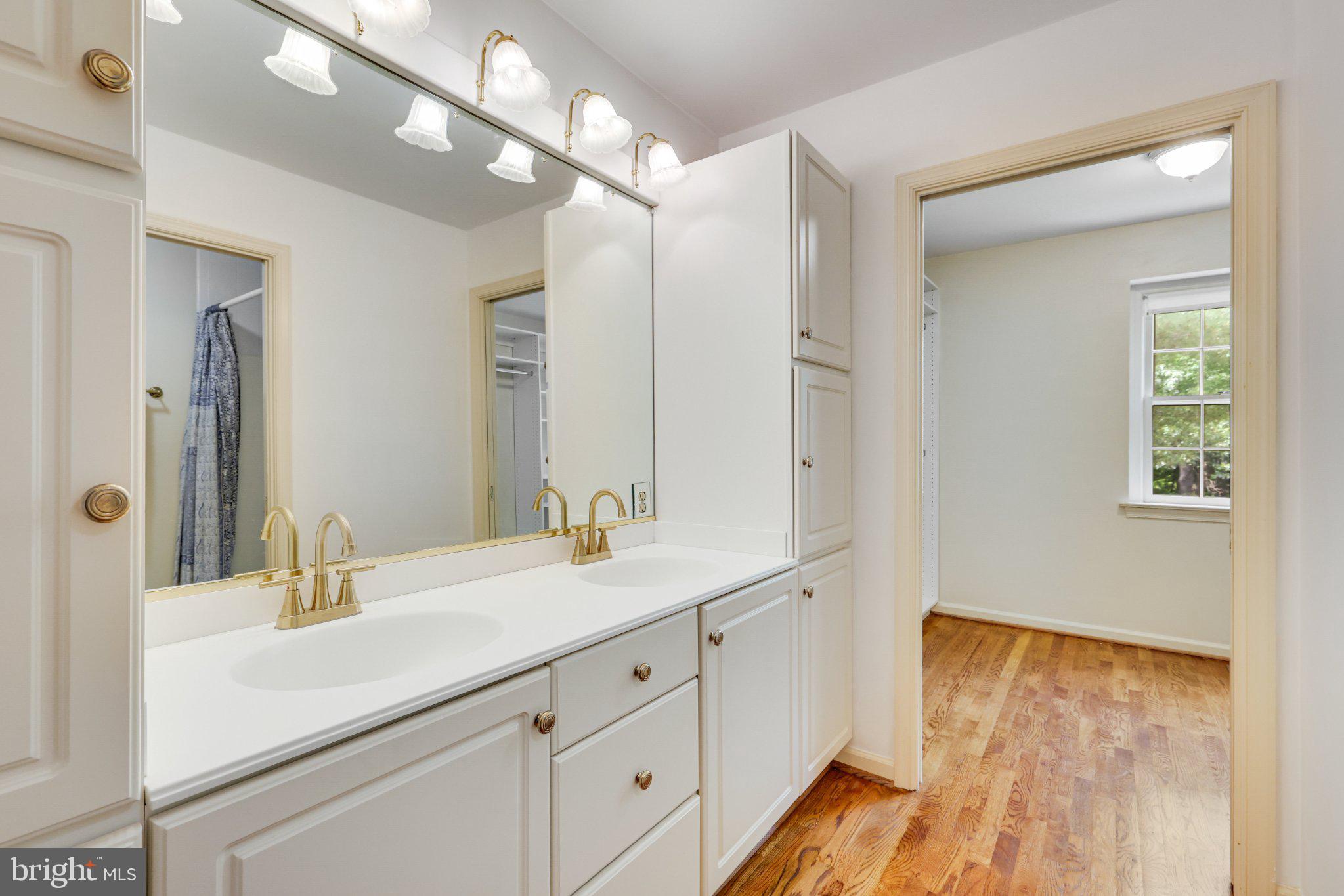 1427 Laurel Hill Road Vienna, VA 22182 - Photo 32 of 57 Elegant dual vanity in bright space.