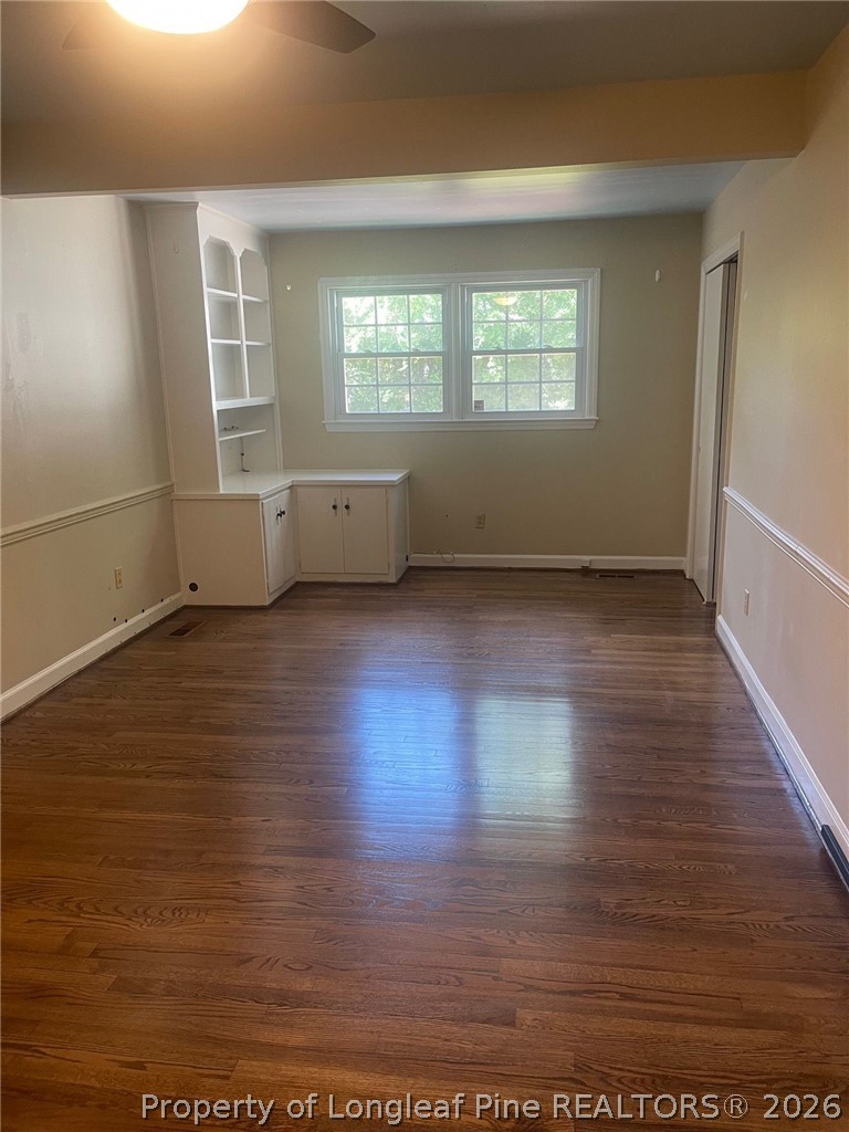 2515 Fort Bragg Road Fayetteville, NC 28303 - Photo 12 of 23 an empty room with wooden floor and windows