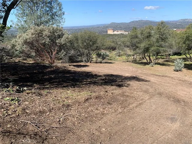 a view of a yard with mountain