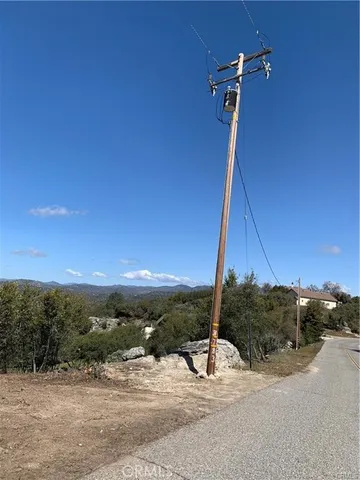 a view of a road with a building in the background
