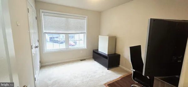 a workspace with furniture and a window