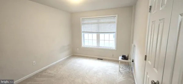 a view of a room with a window