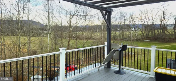 a view of a two chairs and table in the balcony
