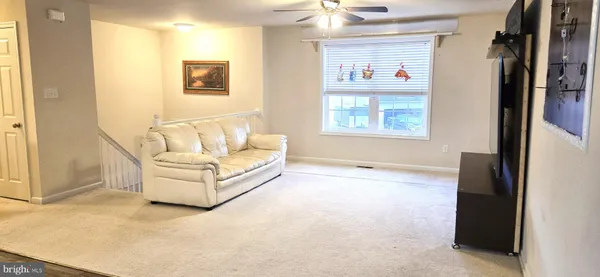 a white tub sitting in a room next to a window