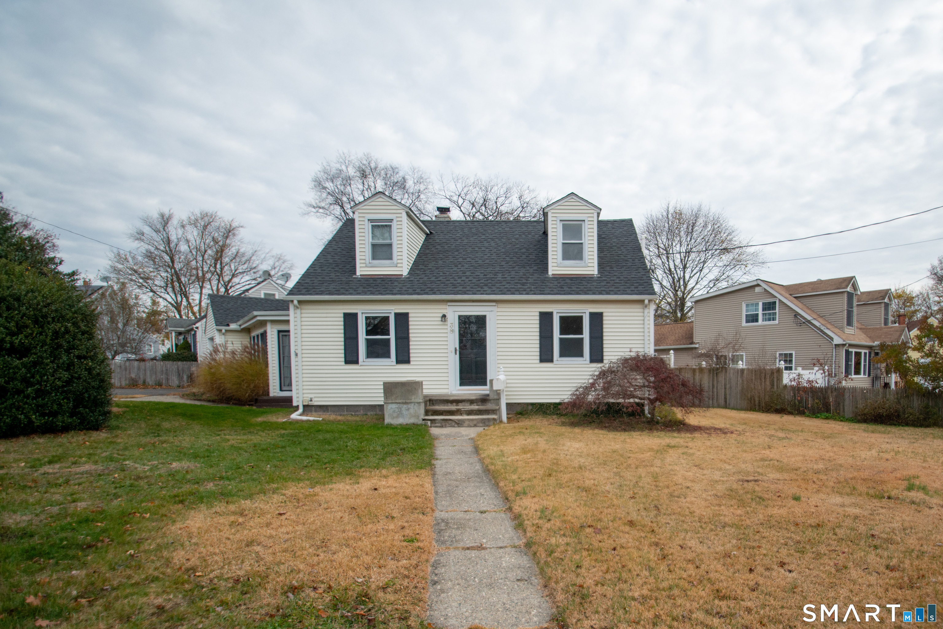 a front view of a house with a yard