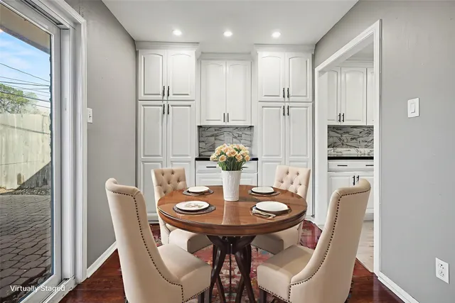 a kitchen with stainless steel appliances granite countertop a refrigerator a stove and a sink