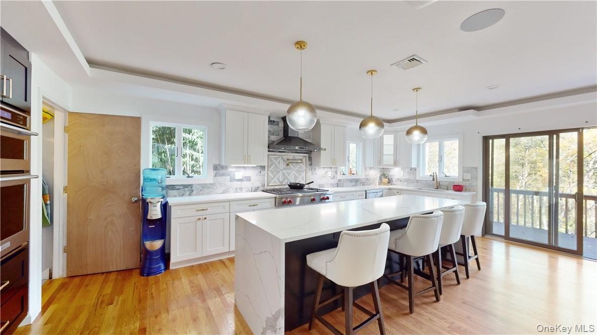 96 Old Pascack Road Pearl River, NY 10965 - Photo 11 of 41 a large kitchen with a table and chairs