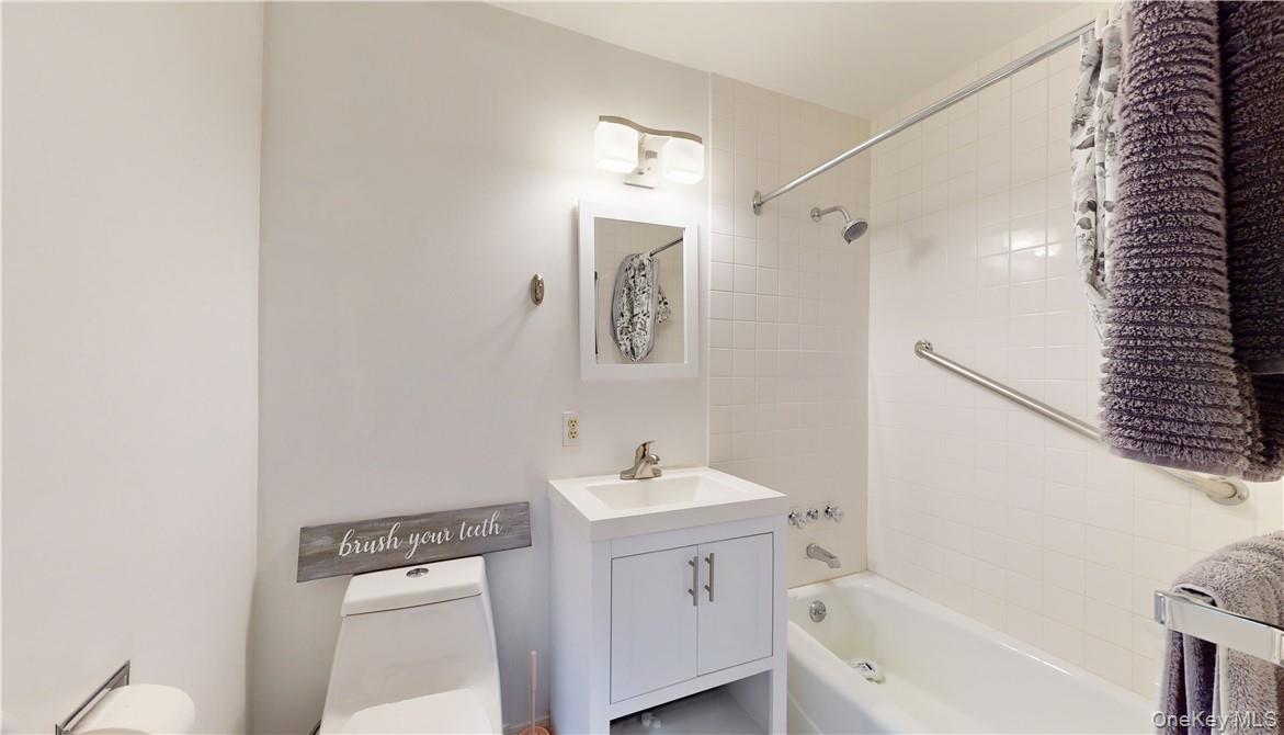 96 Old Pascack Road Pearl River, NY 10965 - Photo 16 of 41 a bathroom with a sink a mirror and a bathtub