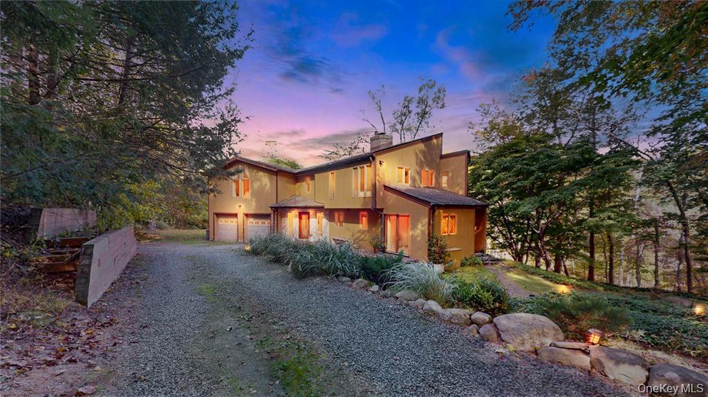 96 Old Pascack Road Pearl River, NY 10965 - Photo 2 of 41 a front view of a house with a yard