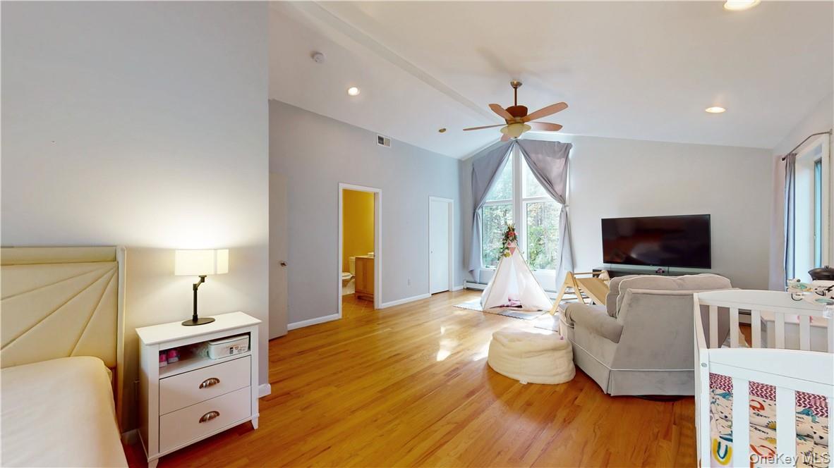 96 Old Pascack Road Pearl River, NY 10965 - Photo 24 of 41 a bedroom with furniture and a flat screen tv
