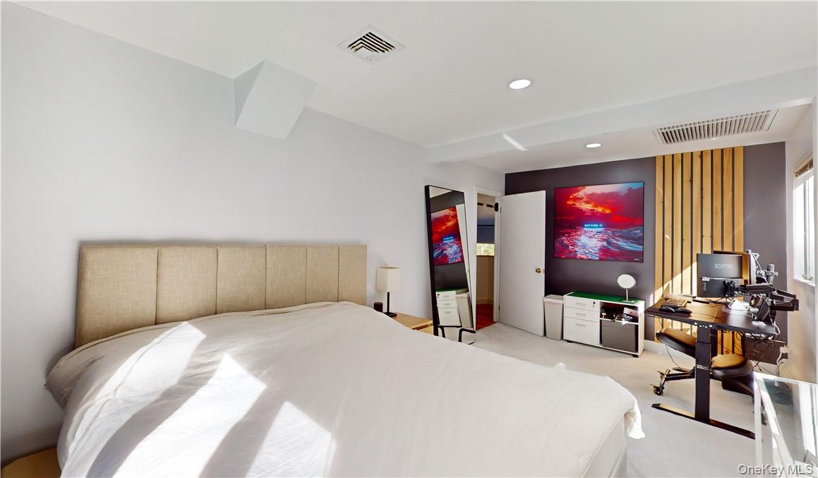 96 Old Pascack Road Pearl River, NY 10965 - Photo 27 of 41 a bedroom with a bed and glass windows