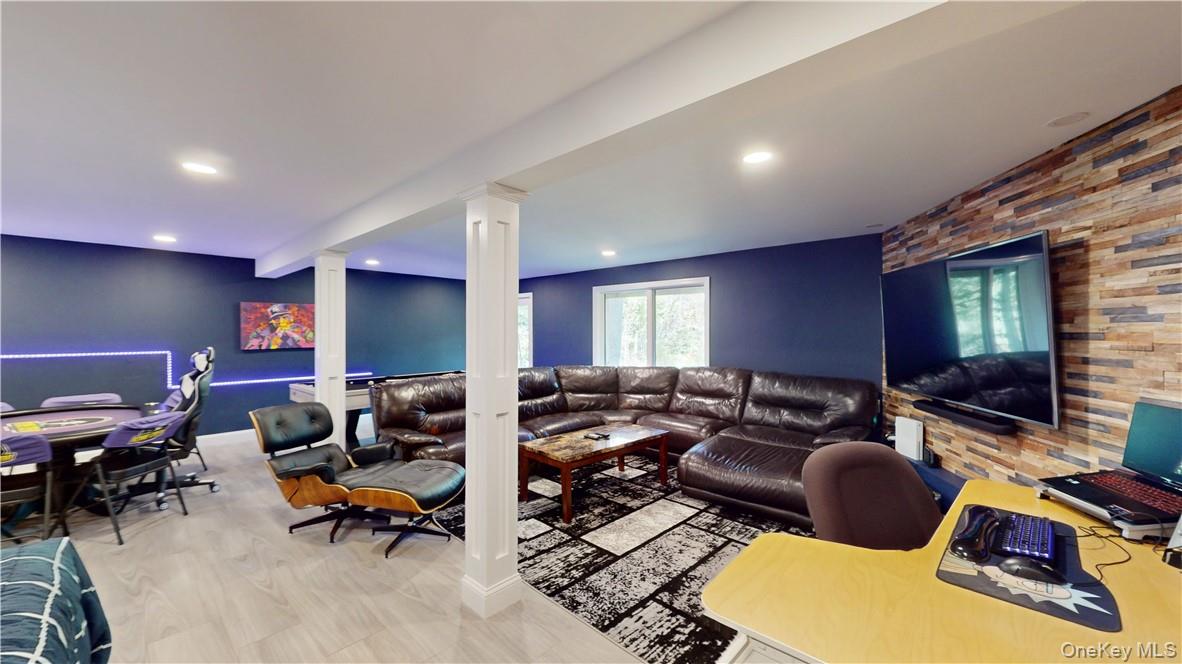 96 Old Pascack Road Pearl River, NY 10965 - Photo 30 of 41 a living room with furniture wooden floor and a flat screen tv