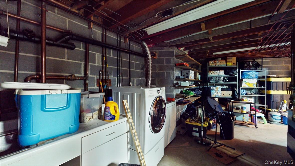 96 Old Pascack Road Pearl River, NY 10965 - Photo 32 of 41 a view of a storage room with washer and dryer