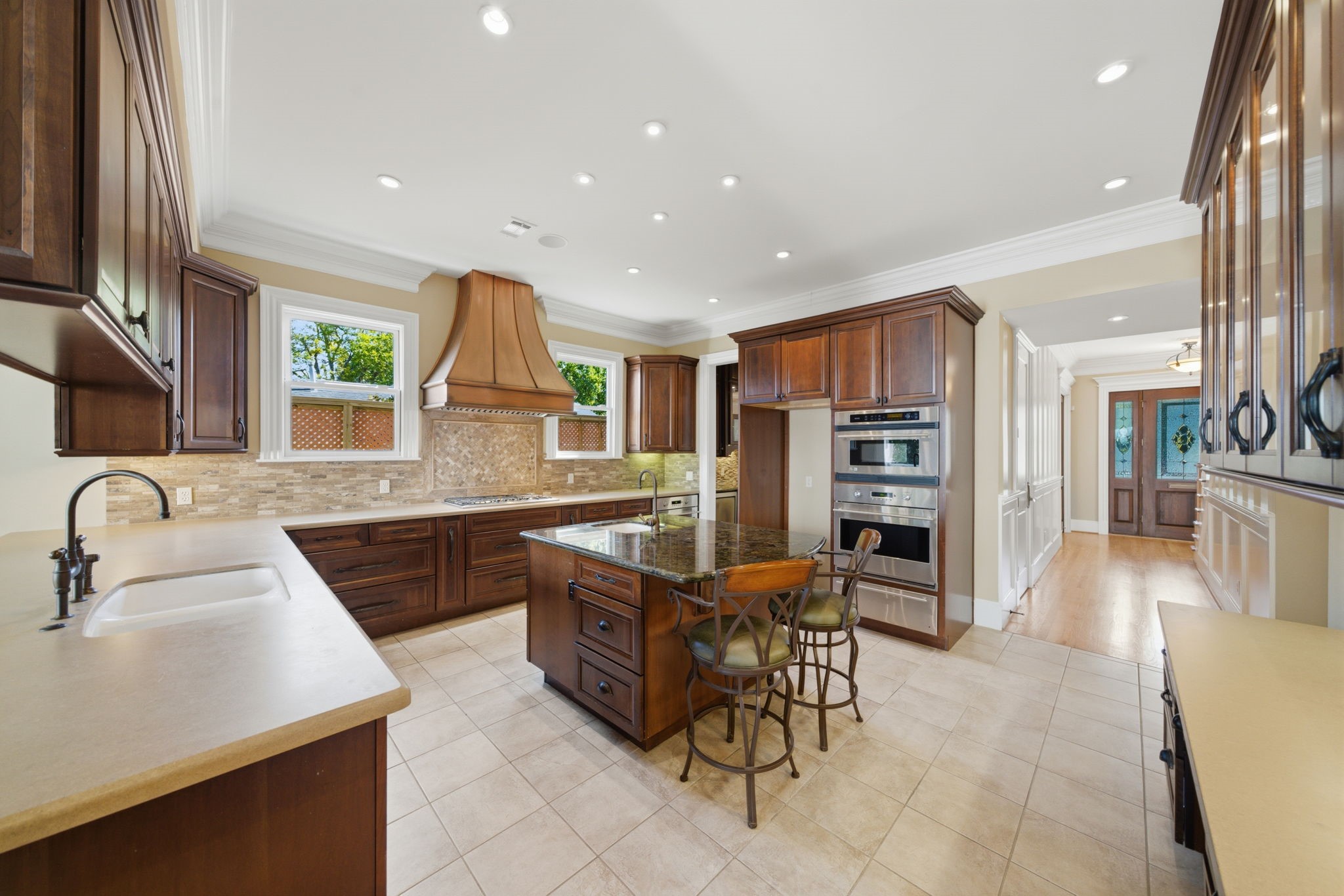 607 East 15th Street Houston, TX 77008 - Photo 15 of 45 a kitchen with stainless steel appliances kitchen island granite countertop a sink and a refrigerator