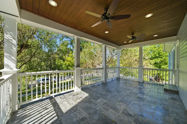 a view of a porch with wooden floor