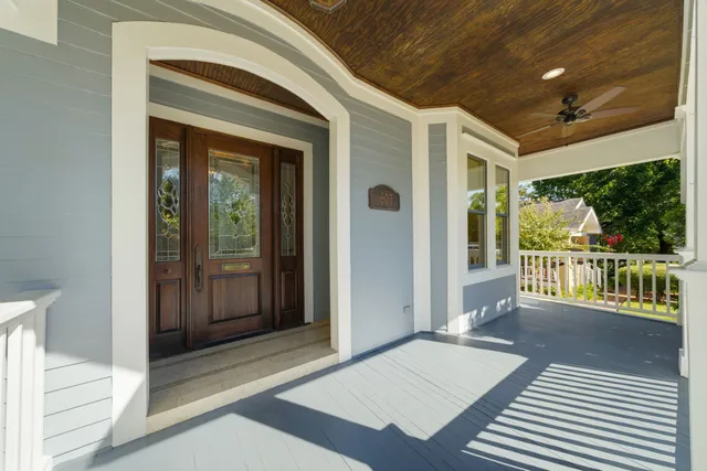 a balcony view with a glass door