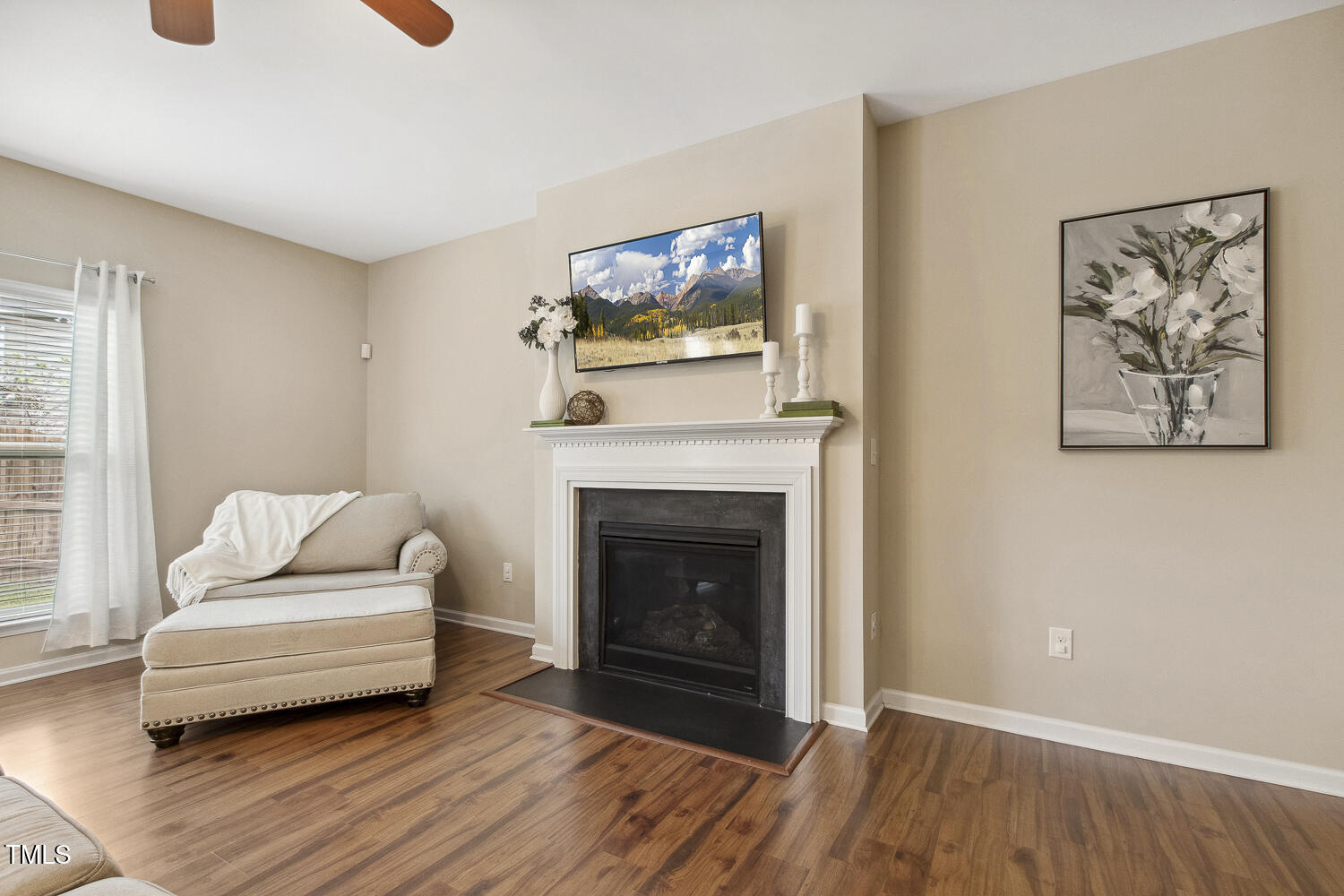 3571 Eastern Branch Road Raleigh, NC 27610 - Photo 2 of 13 a living room with furniture and a fireplace