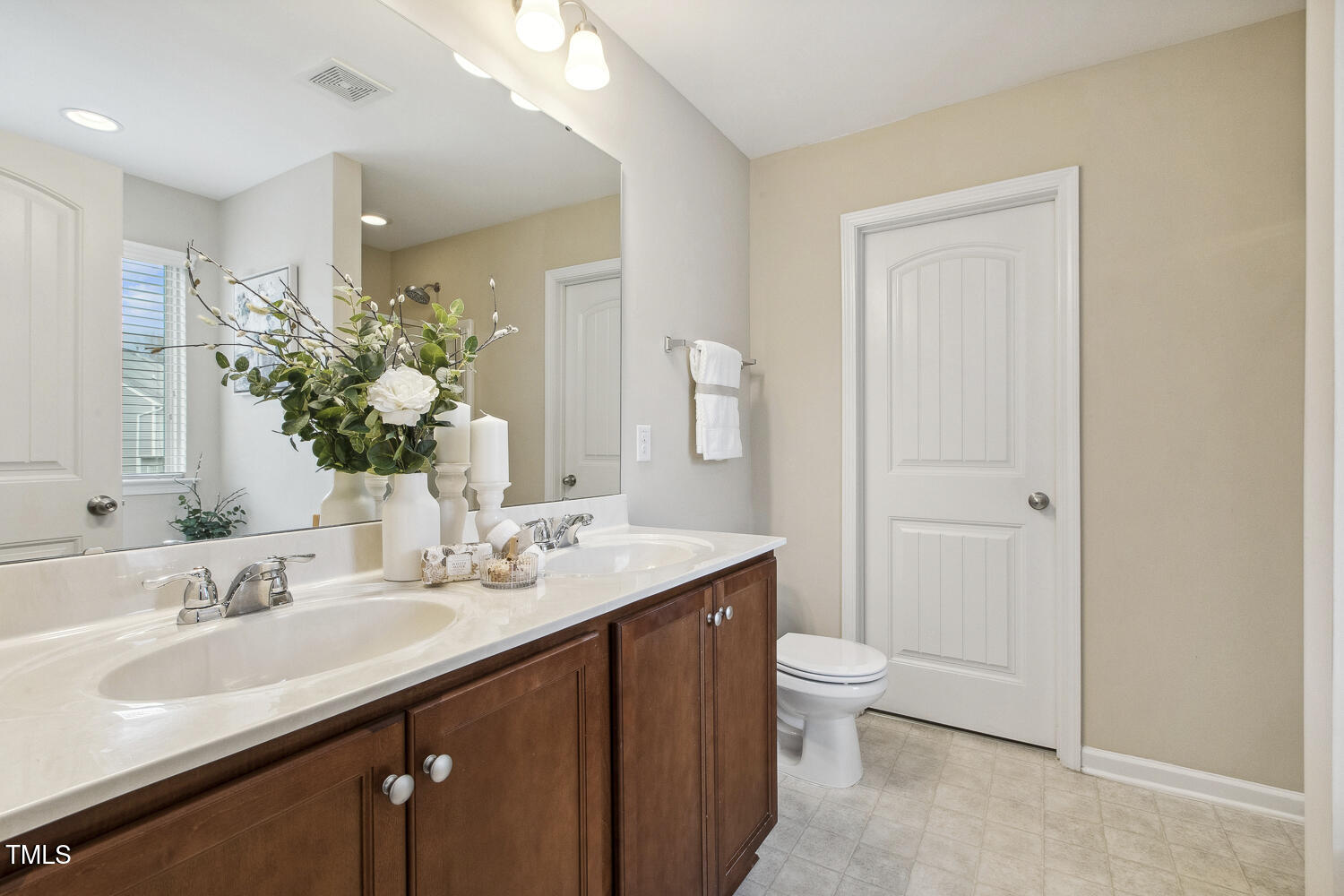 3571 Eastern Branch Road Raleigh, NC 27610 - Photo 8 of 13 a bathroom with a sink a toilet and a large mirror