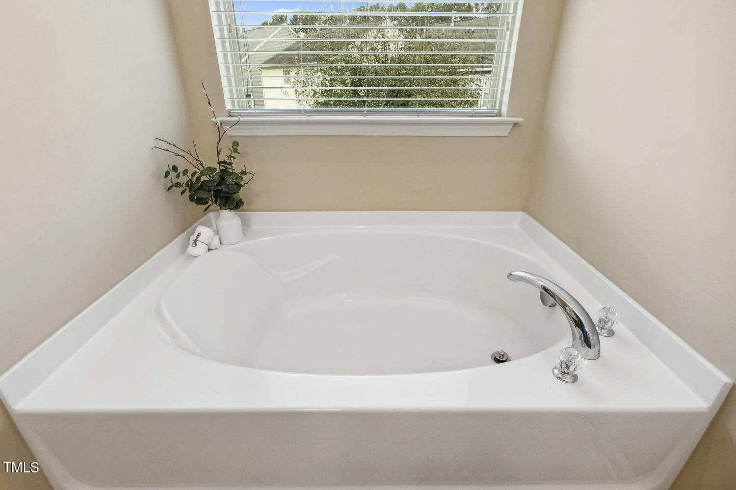 3571 Eastern Branch Road Raleigh, NC 27610 - Photo 9 of 13 a white bath tub sitting in a bathroom