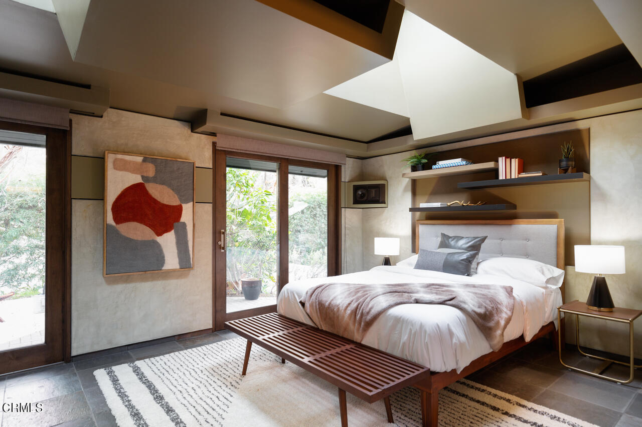 1439 Lida Street Pasadena, CA 91103 - Photo 17 of 39 a bedroom with a bed and wooden floor